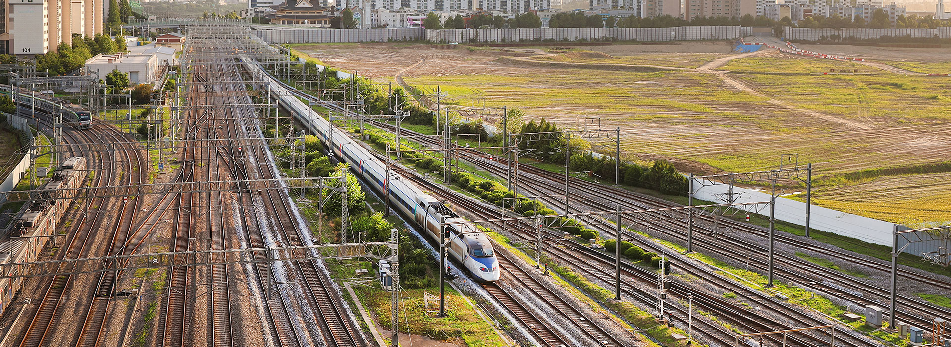 Aerial view of multiple rail tracks and trains